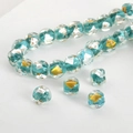 Macro shot of peacock blue handmade glass beads with embedded gold leaf for jewelry making - Peacock Green Square #6