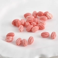 Macro shot of pink carved pumpkin beads with vintage swirl texture for DIY jewelry making - Style 2 Rice Bead Twisted (Approx 10x6.6mm Hole 0.8mm)