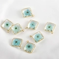 Detailed macro of square 14k gold-plated pendants with blue dried flowers in resin - 12# Blue Flower Square