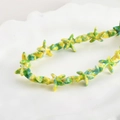 Detailed macro view of starfish-shaped resin beads with vibrant vintage oil paint texture - Blue Yellow Green Starfish