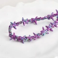Detailed macro view of vintage purple and turquoise starfish beads for DIY jewelry making - Quicksand Purple Starfish