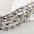 Macro detail of starfish synthetic stone beads with vintage artistic ink splash patterns - Black Spotted Pink Blue Starfish