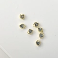 Close-up of 14k gold-plated heart charms with grey faceted crystals for jewelry making - Light Gray Zirconia