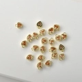 Macro shot of 14k gold plated heart pendants with champagne zircon for jewelry DIY - Champagne Zirconia