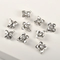 Macro shot of 14k gold-plated flower pendants with sparkling cubic zirconia stones - Silver Four-petal Flower (Approx 11.5*11mm)