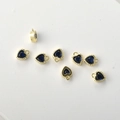 Macro shot of 14k gold-plated heart charms with navy blue cubic zirconia for jewelry DIY - Dark Blue Zirconia