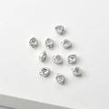 Macro shot of 14k gold-plated heart charms with clear cubic zirconia for jewelry DIY - Platinum Color White Zirconia