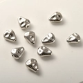 Macro shot of silver plated irregular baroque teardrop beads with hammered texture detail - Irregular Teardrop / 1 Piece/Pack (11.6x9.5mm) / White Gold