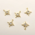 Detailed view of 14k gold-plated star pendants with zircon inlay for DIY jewelry making - Starburst Design / 14k Gold Starburst