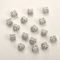 Macro view of silver cylinder spacer beads with inlaid clear cubic zirconia for DIY jewelry - White Gold Short Barrel Style