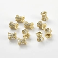 Detailed macro view of 14k gold plated waist tube beads set with sparkling zircons for DIY - 14K Gold Filigree Style