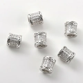 Macro detail of 14k gold-plated cylinder beads with pavé zircon and hollow pattern - 14#G Model White Gold Barrel Bead (Approx 7*6.6mm Hole 3.4mm)