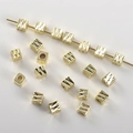 Macro shot of 14k gold-plated square smile beads with diamond-cut geometric texture - 14k Gold Engraved Square (4mm Hole 2.2mm)