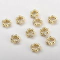 Detailed view of 14k gold-plated floral spacer beads with sparkling zircon for DIY jewelry - Dot Style / 14K Gold