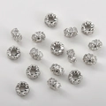 Macro view of heart-shaped hollow charms with sparkling cubic zirconia for DIY jewelry - Heart Style / White Gold