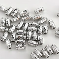 Macro shot of silver plated cylindrical spacer beads with embossed textured patterns for DIY jewelry - Style D / 10 Pieces (7.8*4mm) / Silver