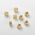 Macro view of 14k gold plated four-leaf flower beads with micro-set zircon stones - 14K Small Flower Spacer Bead (11#)