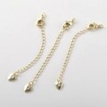 Dettaglio di catene di estensione placcate oro 14k con chiusura a moschettone - Oro 14K Cuore con Singolo Zircone