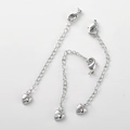 Dettaglio di tre catene di estensione in argento con chiusura a moschettone e zircone a cuore - Oro Bianco Cuore Zircone