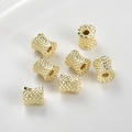 Macro shot of 14k gold-plated textured spacer beads with honeycomb patterns for DIY jewelry - 14k Gold Large (10.4x10.4mm)