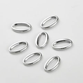 Detailopname van zes gepolijste zilveren ovale schakels voor DIY sieraden en handwerk - Zilver Stijl B Glad Ovaal (15.6x10mm)