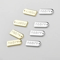 Macro detail of 14k gold and silver plated rectangular letter charms for DIY jewelry - 15*6.6mm / 14k Gold Rectangle Tag