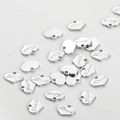 Macro view of scattered silver heart charms with Love engraving for DIY jewelry - 6.8*8mm / White K Small Heart Tag (6.8*8mm)