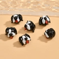 Macro detail of handmade dog-shaped glass beads for DIY jewelry and bracelets - Black Dog (15x11mm)
