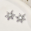 Macro detail of snowflake pendant featuring purple marquise gems and a center zircon - 17# White K-Purple Zirconia Snowflake