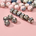 Détail de perles citrouille en céramique vintage marbrées et émaillées pour bijoux DIY - Perle Citrouille Bleu Café