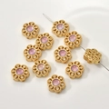 Macro detail of gold flower charm with purple stone and pave cubic zirconia beads - Sunstone Color Snowflake Spacer (7#)