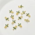 Macro detail of 14k gold-plated pineapple charms with yellow and green cubic zirconia - Yellow Pineapple / 1 Piece (Approx 7.9*11.3mm)