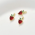 Detailed view of three apple-shaped 14k gold pendants with red heart gemstones - 1 Piece (Approx 5.6*11.6mm)