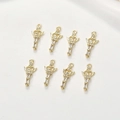 Macro detail of eight 14k gold plated castle fairy magic wand pendants with cubic zirconia - Gold Magic Wand