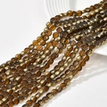 Flat round amber crystal glass beads with gold plated edges for DIY jewelry making - Caramel color