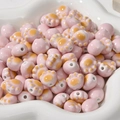 Pink ceramic cat paw loose beads with yellow pads in a white floral plate for DIY jewelry - Pink Cat Paw (approx 11.3*12.5mm)