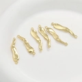 Detailed view of 14k gold-plated wavy brass link connectors for DIY jewelry making - Fat Irregular Double Hole (33.4x6.4mm) / Gold