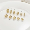 Macro view of 14k gold-plated spacer beads with cubic zirconia for DIY jewelry making - Model A (H-125) / Gold