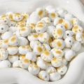 Macro detail of cat paw ceramic beads with yellow paw prints and center holes for DIY crafts - White Cat Paw (approx 11.3*12.5mm)