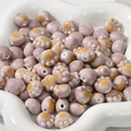 Macro shot of purple ceramic cat paw beads with yellow accents for DIY jewelry making - Bean Paste Purple Cat Paw (approx 11.3*12.5mm)