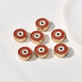 Close-up of golden red evil eye charms for DIY jewelry making and bracelet beads - Round / 1 Piece (12.3x5mm) / Red