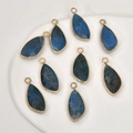 Detail of copper gold-plated faceted teardrop pendants in deep blue natural stone - Apatite (Irregular Shape #5)