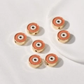 Macro shot of orange enamel evil eye beads for DIY jewelry and bracelet making - Round / 1 Piece (12.3x5mm) / Orange