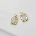 Macro shot of two 14k gold-plated rectangular opal-style pendants for DIY jewelry - White Irregular Opal Drill Rectangular Pendant