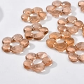 Macro shot of amber glass flower beads with central hole for DIY jewelry making - Flower Style (18#) / 1 Piece / Champagne
