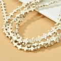 Gros plan de perles en croix turquoise blanche avec texture marbrée pour bijoux DIY - Style de Croix (13#)