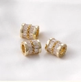 Macro shot of 14k gold-plated barrel beads with cubic zirconia and LOVED engraving - Gold Lettered Zirconia Style (2# B Style)