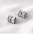 Detailed macro of silver barrel charm with baguette zircons and side letter engraving - Silver Lettered Zirconia Style (7# B Style)