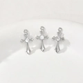 Three silver cross pendants with central zircon and pavé detailing on a ceramic dish - Silver Transparent Zirconia Style (2# White K White Zircon Cross)