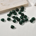 Macro view of irregular dark green glass beads with holes for DIY jewelry making - Dark Green Irregular Shape